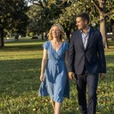 Happy couple walking together in a park during golden hour